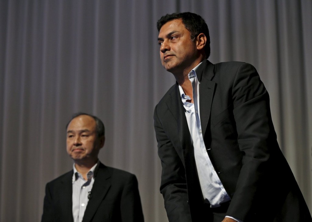 SoftBank Corp. Chief Executive Masayoshi Son and Nikesh Arora, former Google chief business officer and currently SoftBank Vice Chairman, leave a news conference in Tokyo